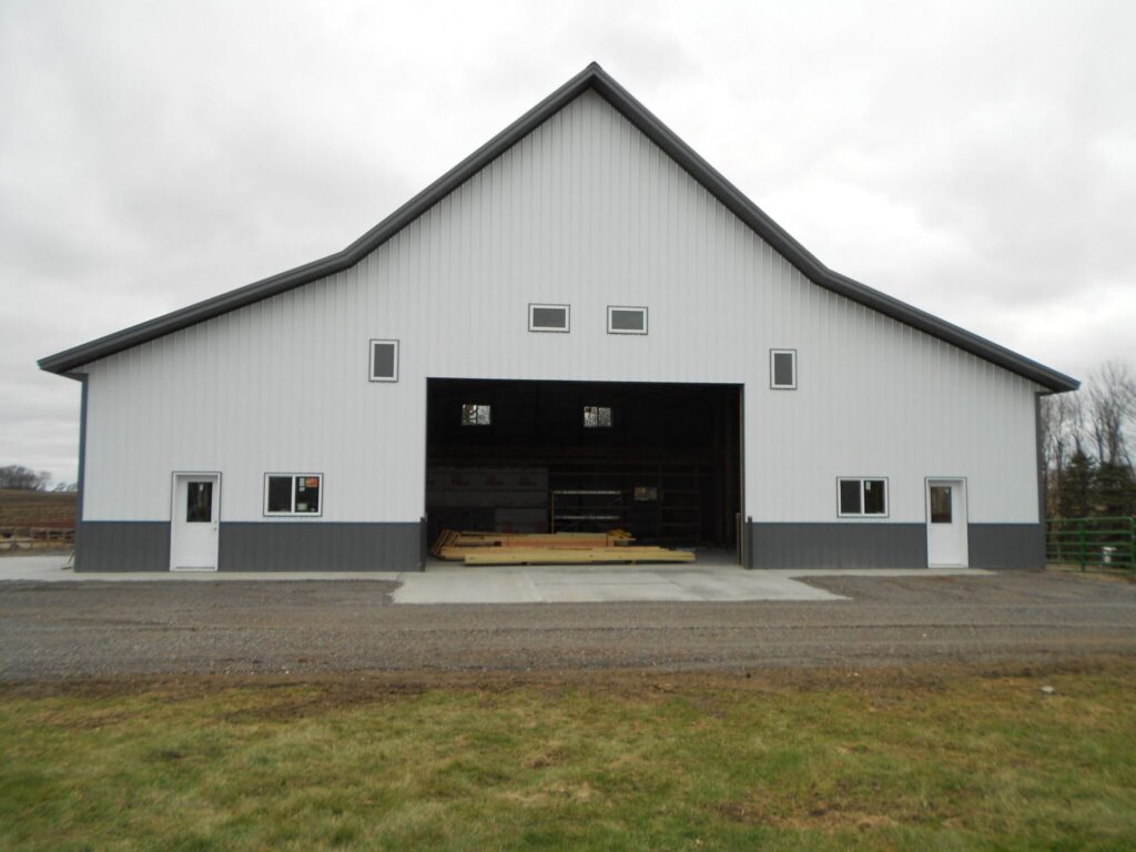 Farm building featuring Heiling barn with a brown and beige exterior