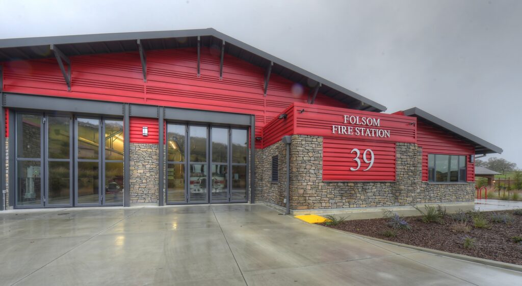 Fire Station Building featuring Folsom Fire Station 39 design with a modern red exterior