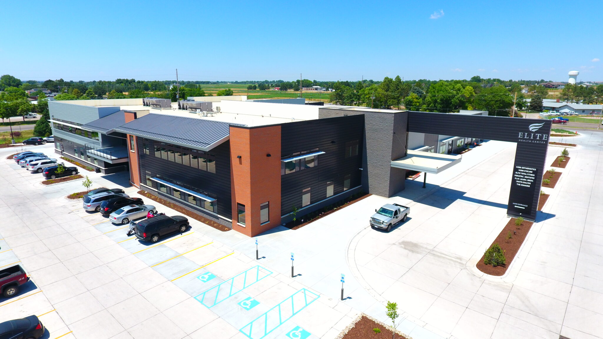 Hospital building featuring Elite Health Center with advanced facilities and spacious parking