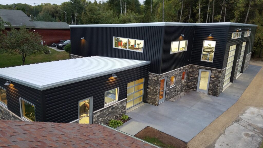 Temme Waterfront Workshop, a modern industrial building with large glass windows and metal siding.