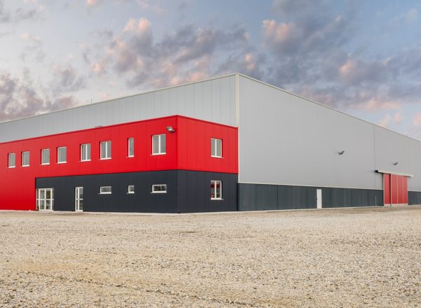 Modern warehouse building with integrated office space, combining functionality and administrative convenience.